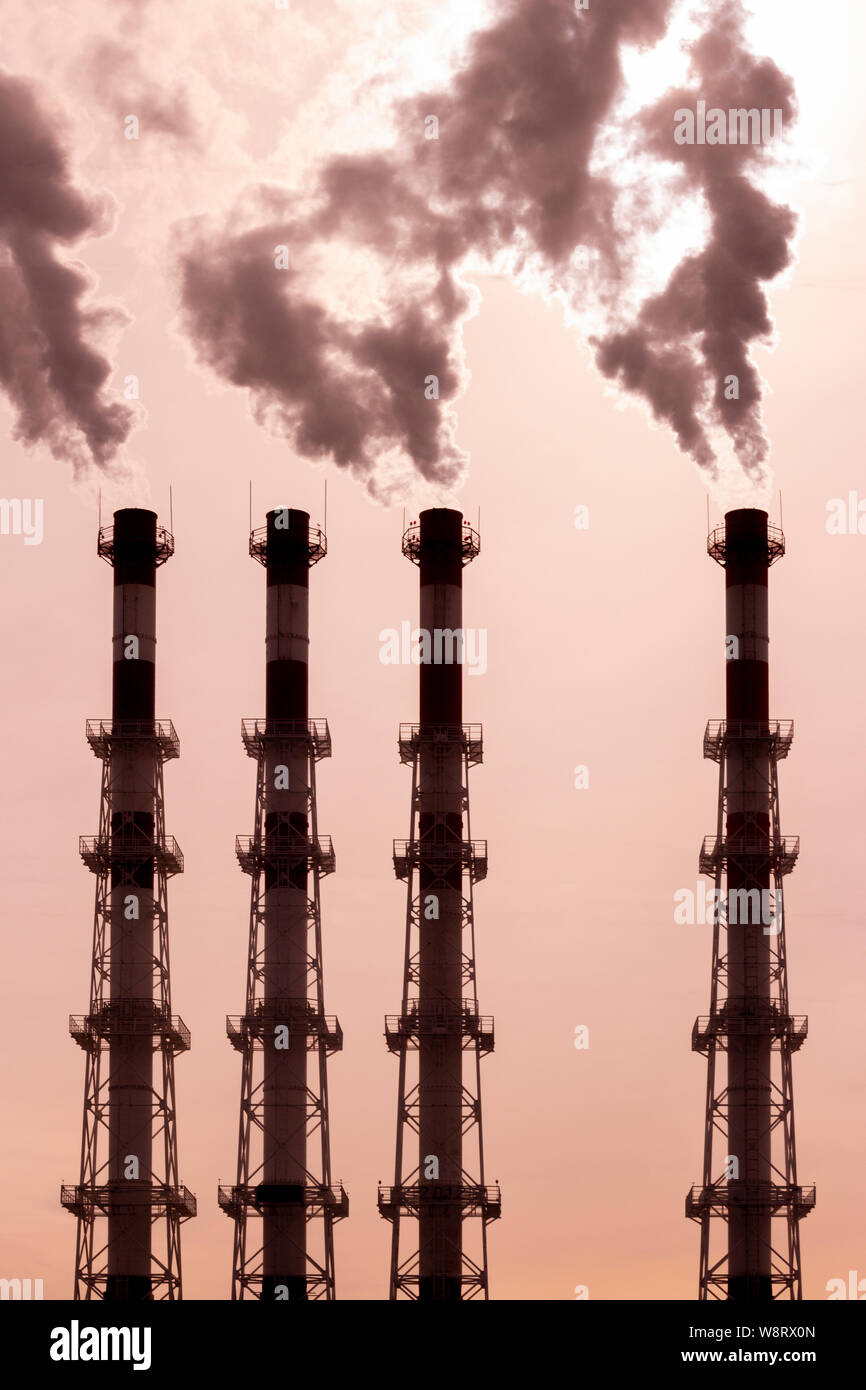 Pipes release dark smoke steam vapor. environmental pollution, air