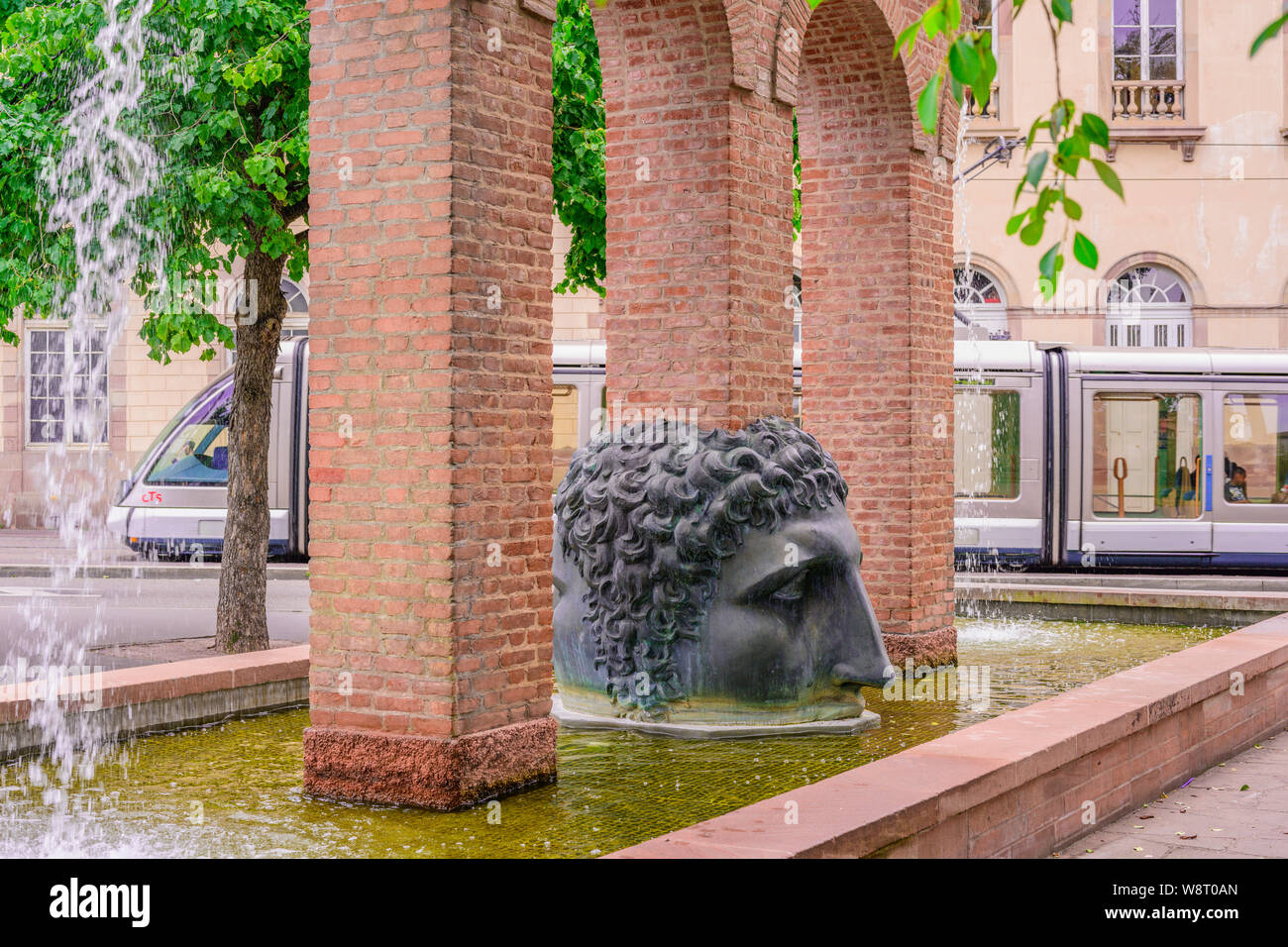 Janus's head sculpture, Birth of Civilization fountain, Roman aqueduct replica, designer Tomi Ungerer 1988, Strasbourg, Alsace, France, Europe, Stock Photo