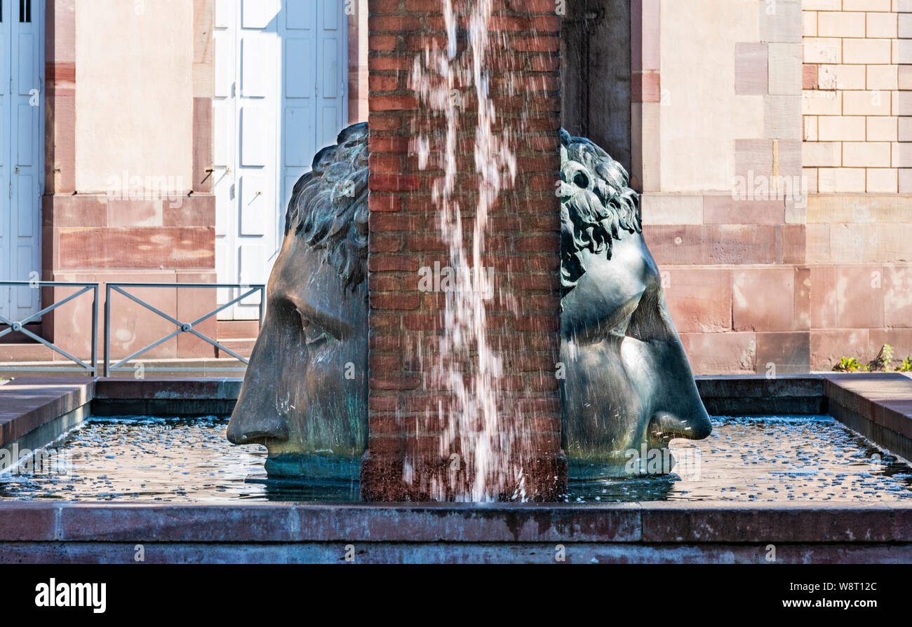 Double faced Janus sculpture, Birth of Civilization fountain, Roman aqueduct replica, designer Tomi Ungerer 1988, Strasbourg, Alsace, France, Europe, Stock Photo