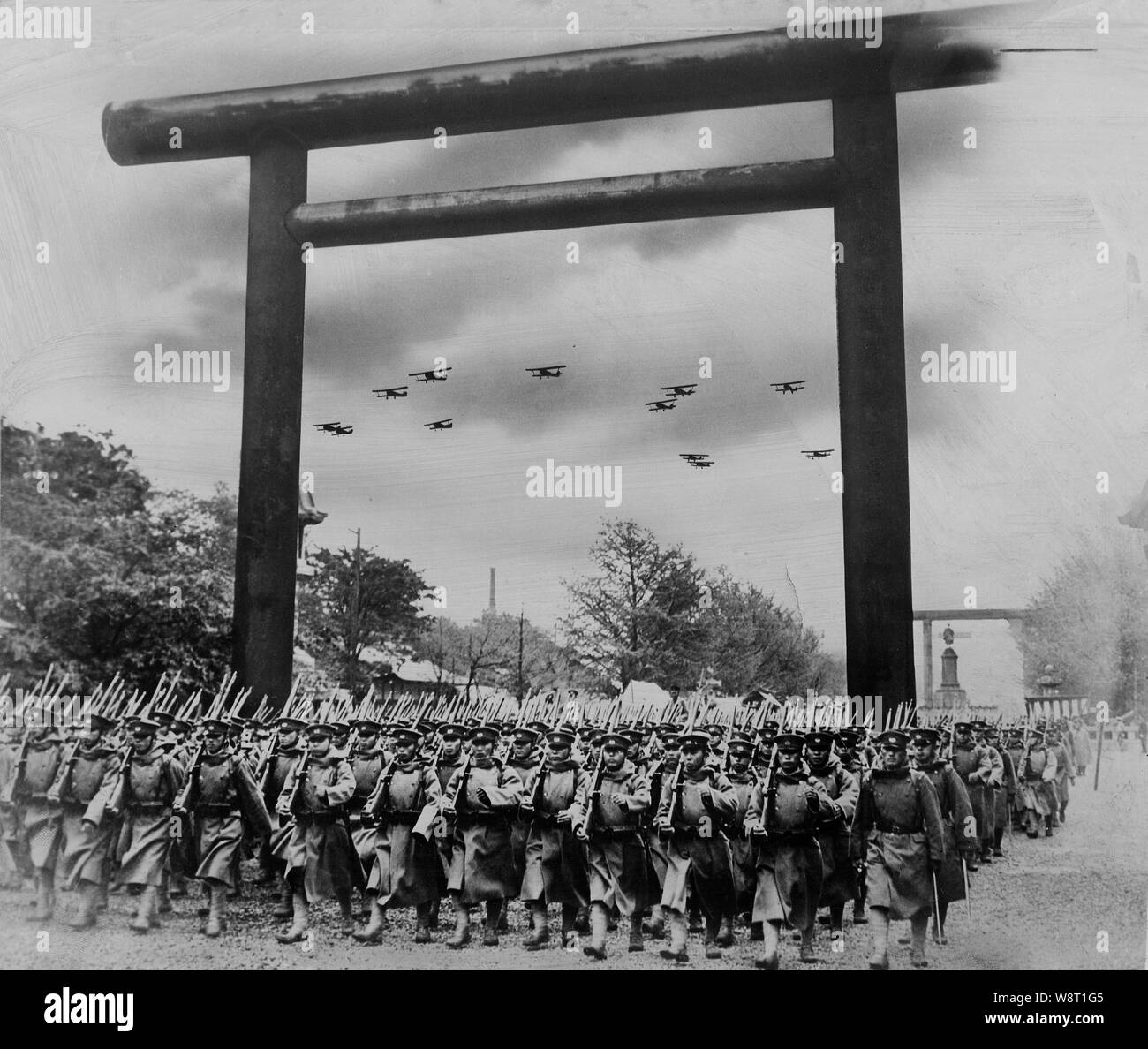 [ 1930s Japan - Japanese Imperial Army Troops at Yasukuni ] —   Troops of the Japanese Imperial Forces are lined up at Yasukuni Shinto Shrine (靖国神社), Kudan (九段), Tokyo.   The shrine was established on June 29, 1869 (Meiji 2) to commemorate the Imperial soldiers who died in the Boshin War (戊辰戦争, Boshin Senso). It was initially called Shokonsha (招魂社), but renamed Yasukuni Jinja on June 4, 1879 (Meiji 12). The torii dates from December 31, 1887 (Meiji 20). Stock Photo