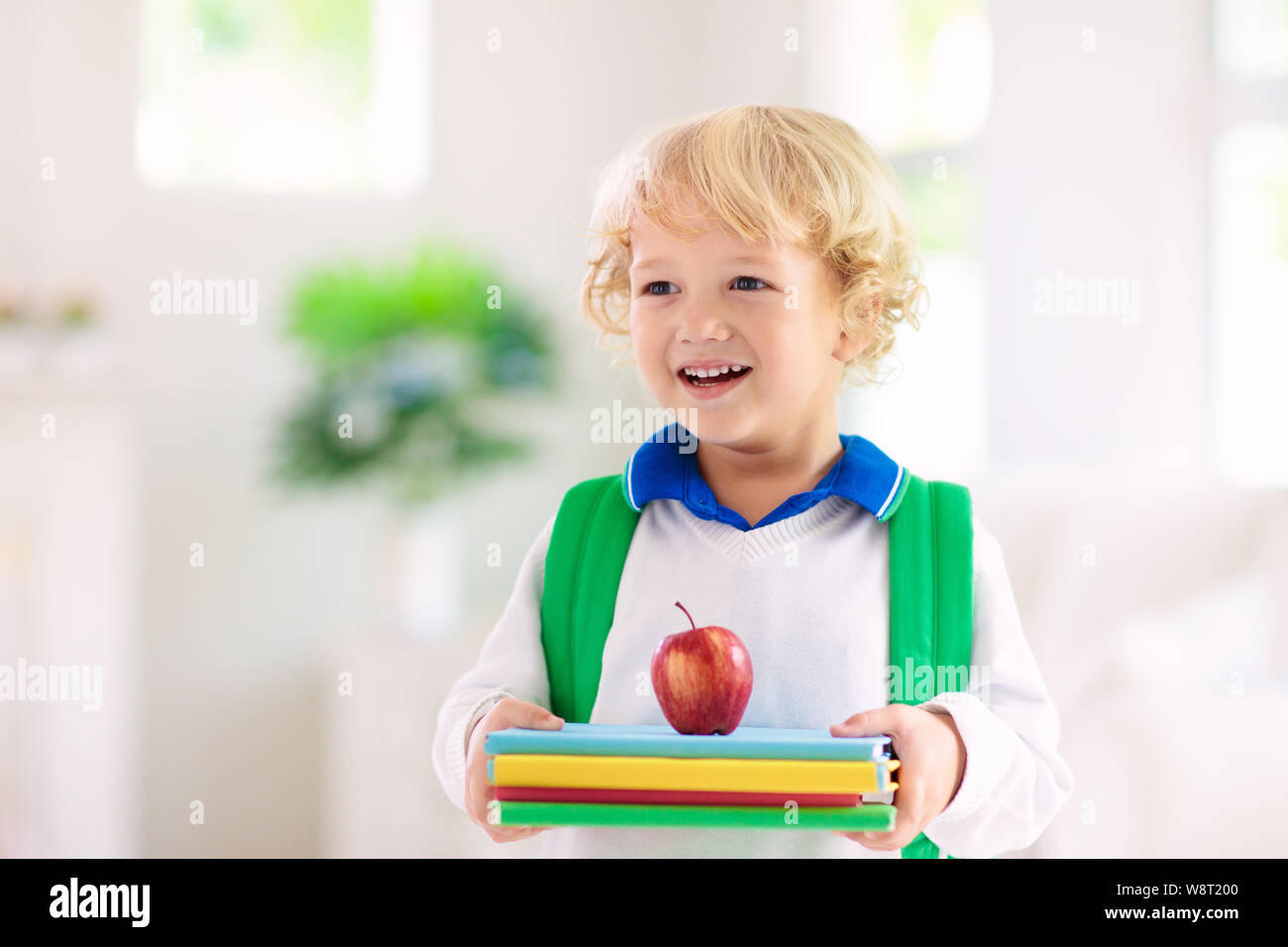Child going back to school. Kid getting ready for first school day after vacation. Little boy on his way to kindergarten or preschool. Student packing Stock Photo