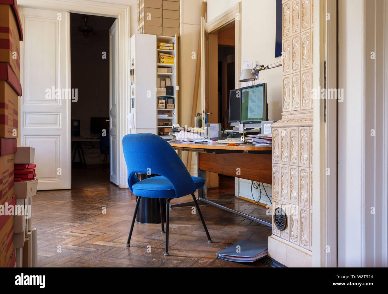 Blue chair, office interior, busy desk, France, Europe, Stock Photo