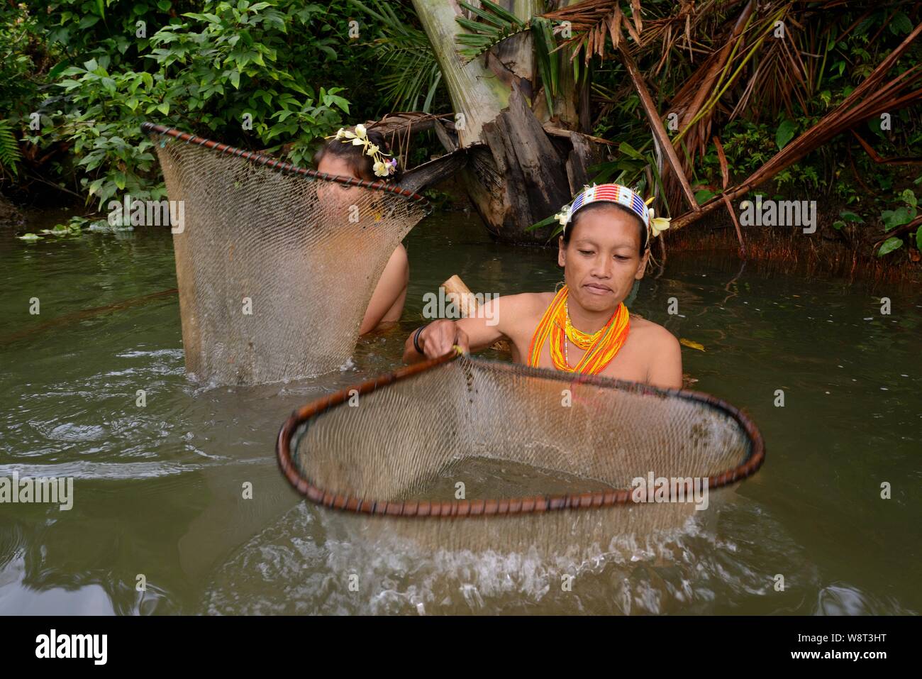 Local woman fishing in a river, Siberut Island, Mentawai-Inseln, Sumatra Stock Photo