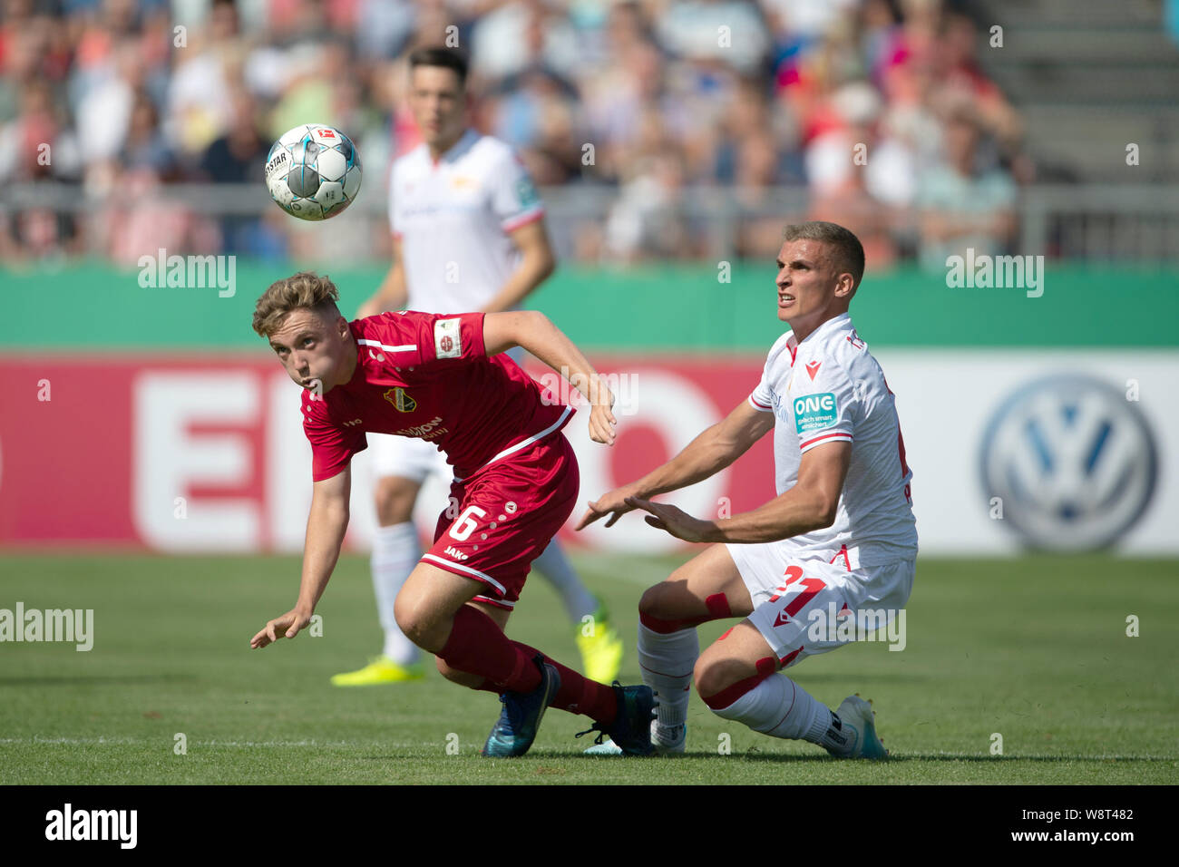 Halberstadt, Germany. 11th Aug, 2019. Soccer: DFB Cup, Germania Halberstadt - 1st FC Union Berlin, 1st round in Friedensstadion. Berlin's Keven Schlotterbeck (r) plays against Halberstadt's Justin Bretgeld. Credit: Swen Pförtner/dpa - IMPORTANT NOTE: In accordance with the requirements of the DFL Deutsche Fußball Liga or the DFB Deutscher Fußball-Bund, it is prohibited to use or have used photographs taken in the stadium and/or the match in the form of sequence images and/or video-like photo sequences./dpa/Alamy Live News Stock Photo