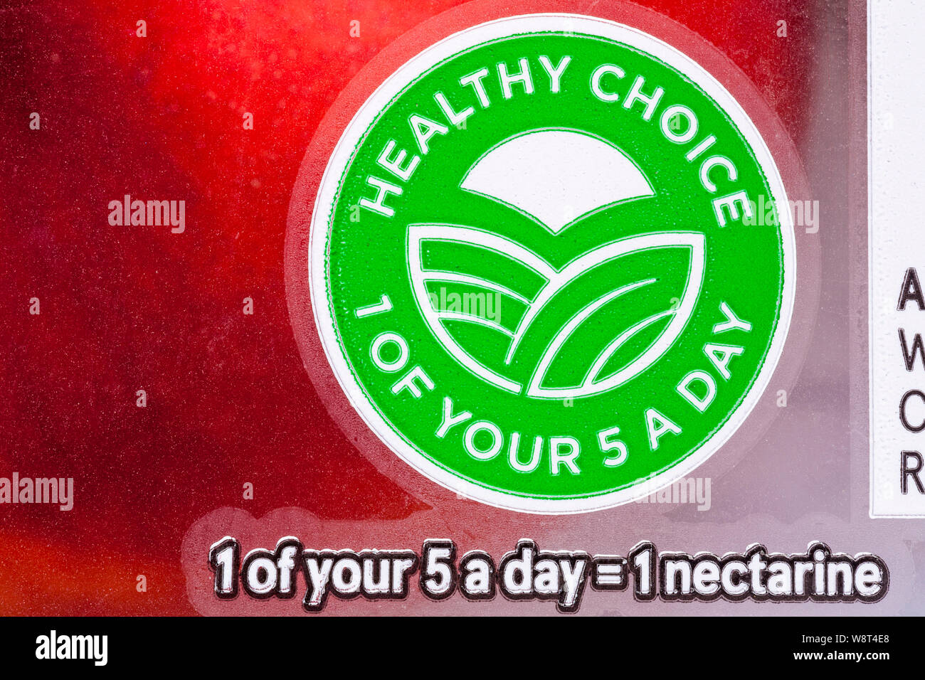 Healthy Choice 1 of your 5 a day = 1 nectarine - detail on punnet of nectarines fruit Stock Photo