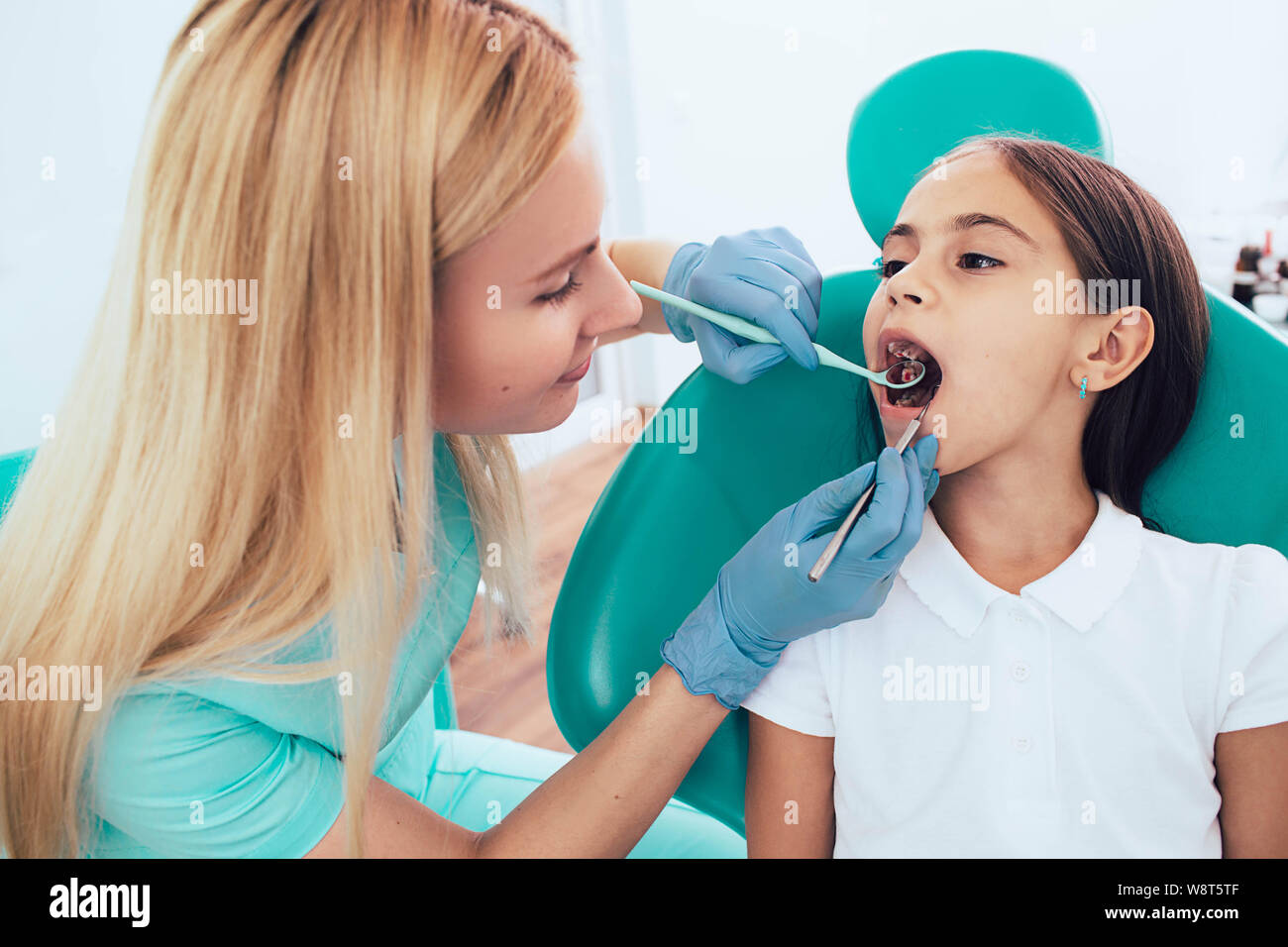 Little Girl Getting Teeth Exam By Pediatric Dentist At Clinic Stock Photo Alamy Little Girl Getting Teeth Exam By Pediatric Dentist At Clinic Stock Photo Alamy