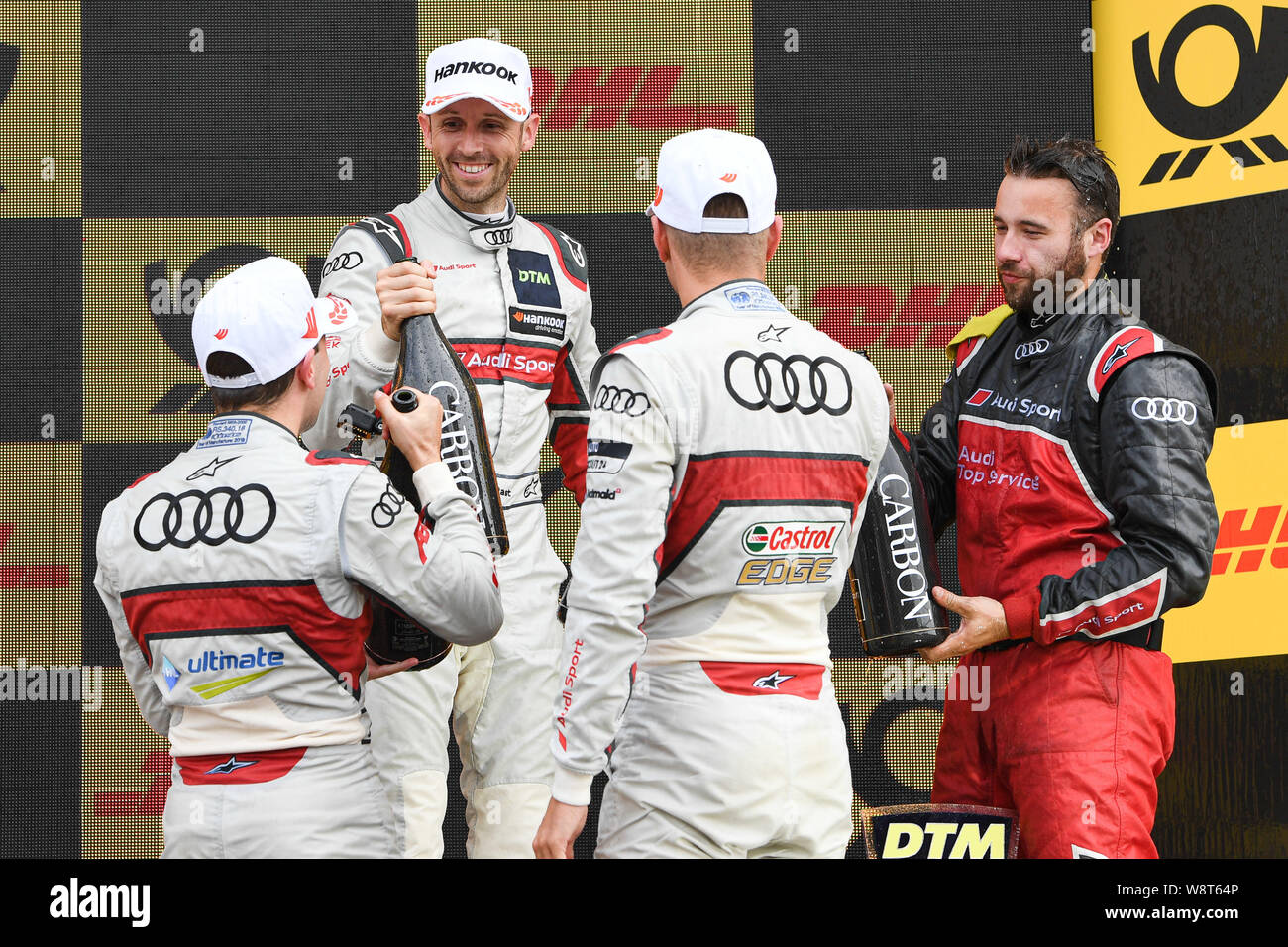 Kent, UK. 11th August 2019. René Rast (Audi Sport Team Rosberg) (centre), Nico Müller (Audi Sport Team Abt Sportsline) (left) and Robin Frijns (Audi Sport Team Abt Sportsline)  (right) congratulate each other at the winner’s presentation during DTM Race 2 of the DTM (German Touring Cars) and W Series at Brands Hatch GP Circuit on Sunday, August 11, 2019 in KENT, ENGLAND. Credit: Taka G Wu/Alamy Live News Credit: Taka Wu/Alamy Live News Stock Photo