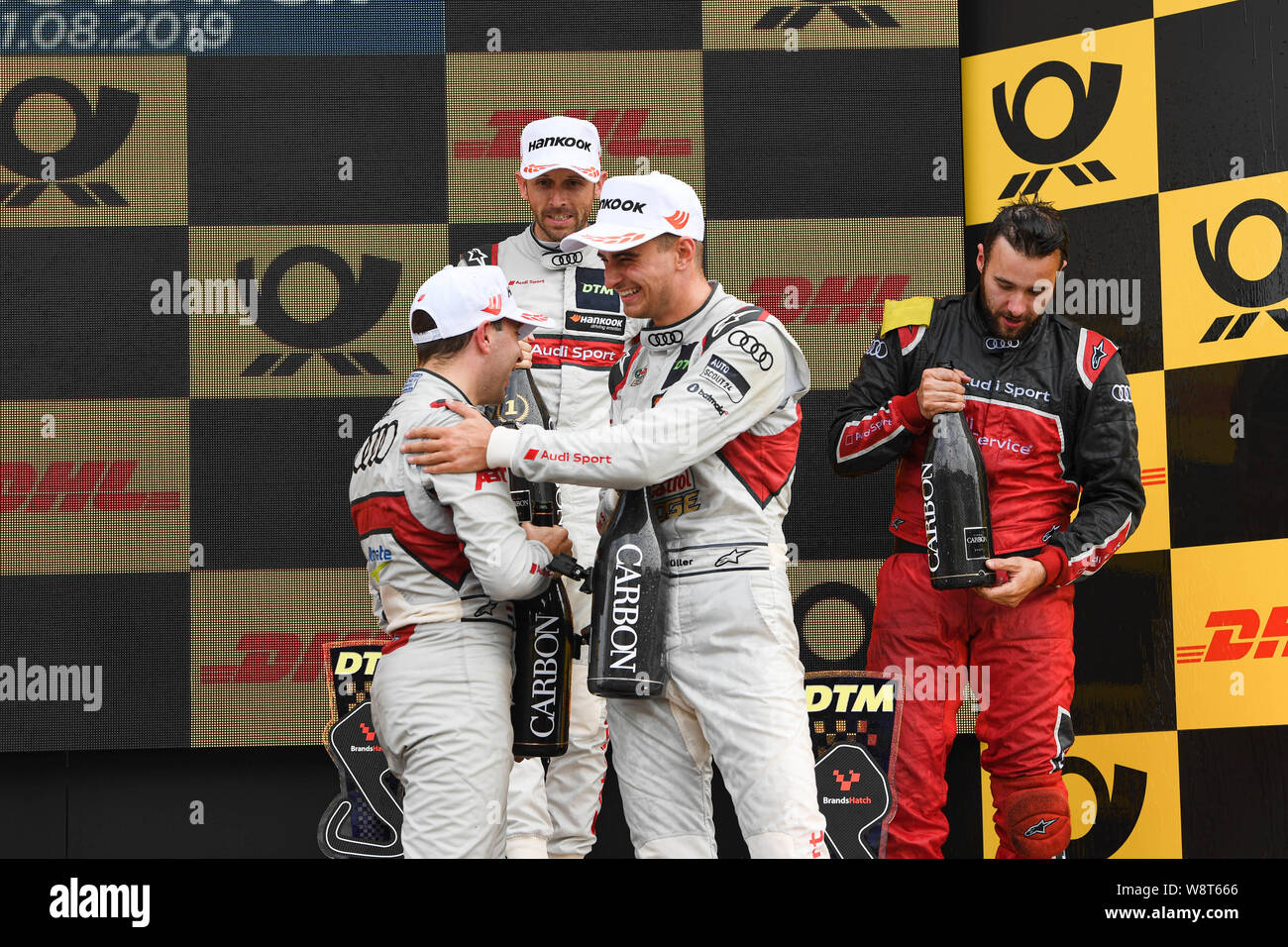 Kent, UK. 11th August 2019. René Rast (Audi Sport Team Rosberg) (centre), Nico Müller (Audi Sport Team Abt Sportsline) (left) and Robin Frijns (Audi Sport Team Abt Sportsline)  (right) congratulate each other at the winner’s presentation during DTM Race 2 of the DTM (German Touring Cars) and W Series at Brands Hatch GP Circuit on Sunday, August 11, 2019 in KENT, ENGLAND. Credit: Taka G Wu/Alamy Live News Credit: Taka Wu/Alamy Live News Stock Photo