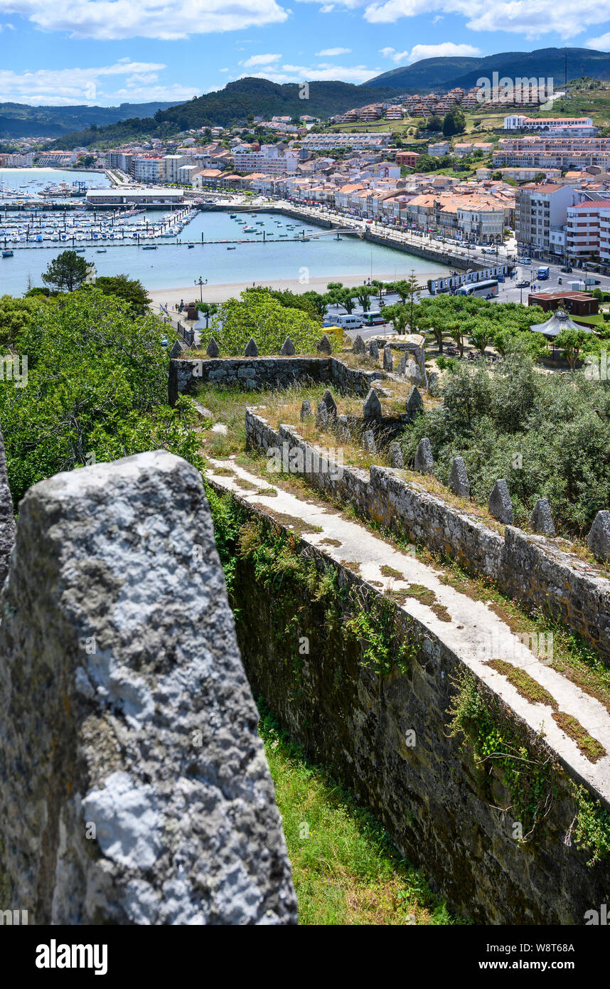 Looking acros the harbour to the old town of Baiona from Monterreal castle, in Pontevedra Province, Southern Galicia, Spain Stock Photo