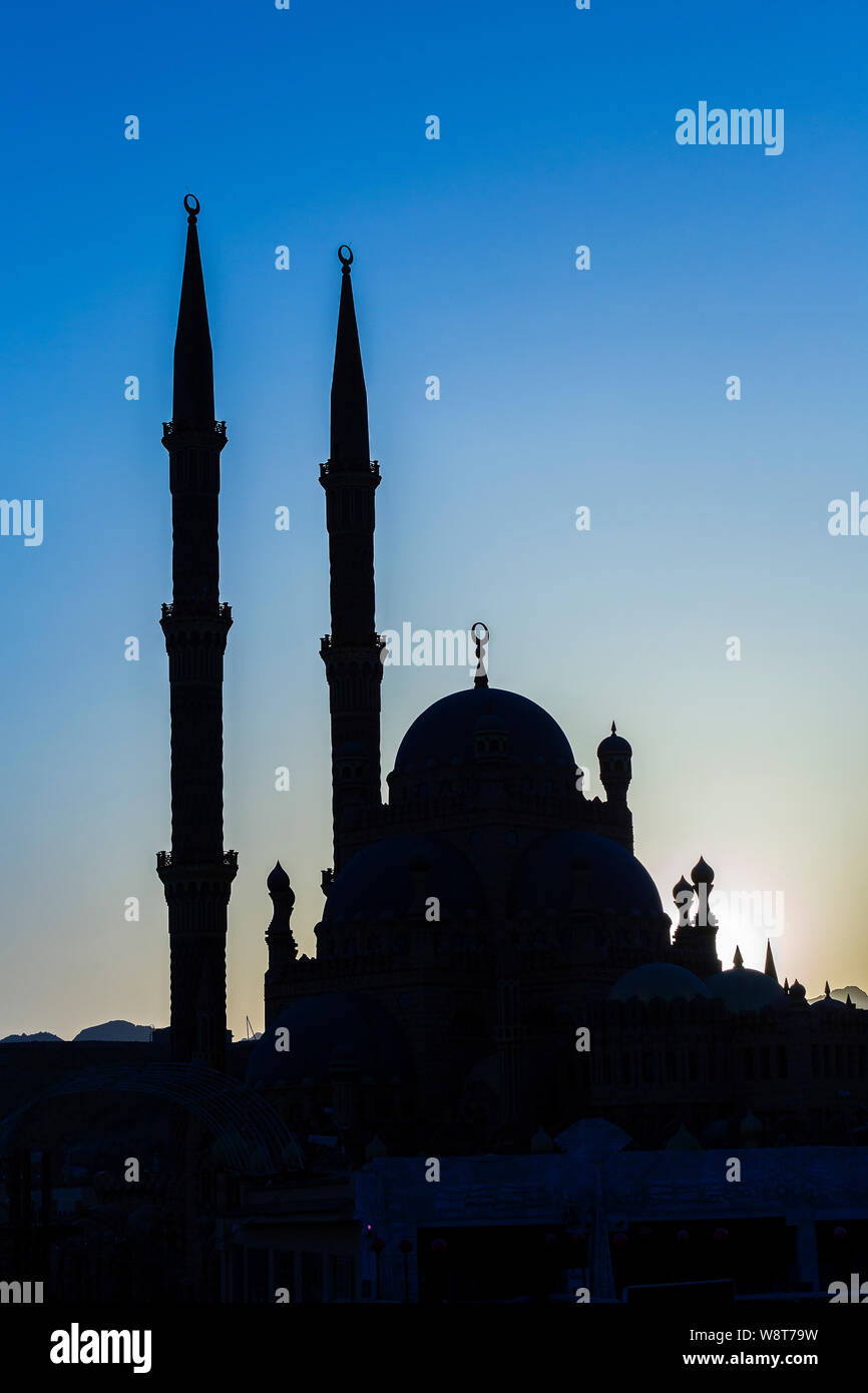 Silhouette Al-Sahaba Mosque at sunset time in Sharm el Sheikh, Egypt. Architecture of Al Sahaba, Al Mustafa, mosque in center of old town includes fus Stock Photo