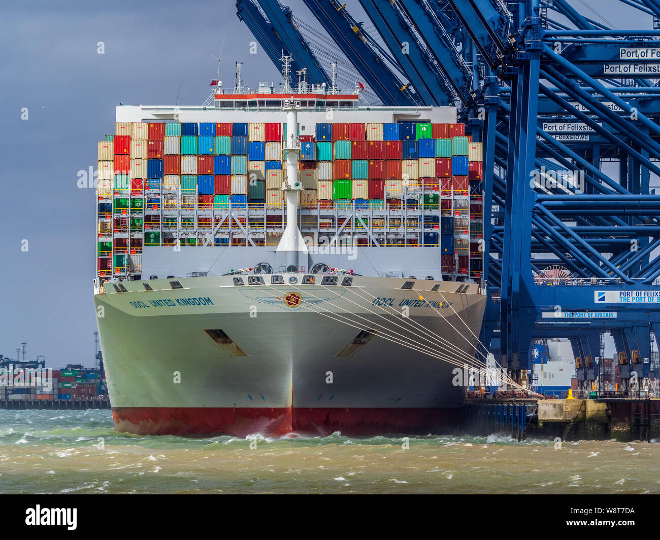OOCL United Kingdom vessel docked at Felixstowe Port to load and unload containers. OOCL is a Hong Kong based shipping company. Stock Photo