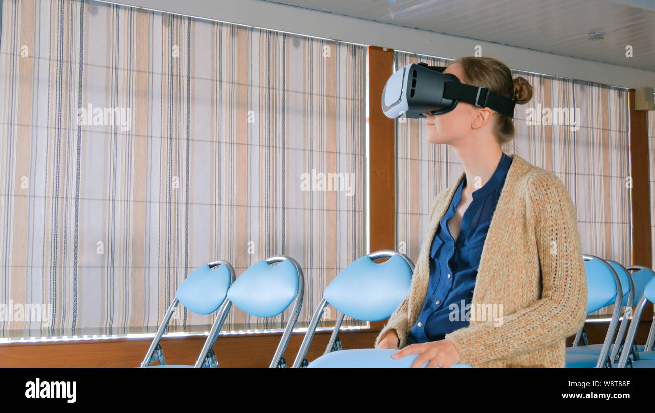 Young woman using virtual reality glasses Stock Photo