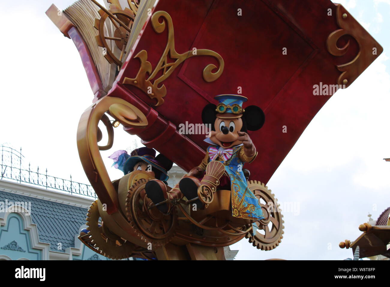 Mickey Mouse Waving To The Crowd During The Disney Parade In Disneyland Mickey Mouse Waving To The Crowd During The Disney Parade In Disneyland