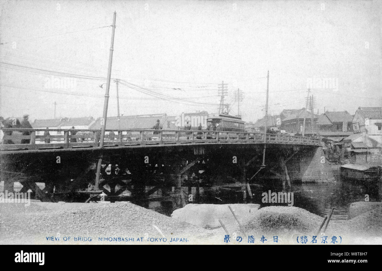 [ 1900s Japan - Old Wooden Nihonbashi Bridge, Tokyo ] —   The wooden Nihonbashi Bridge (日本橋) in Tokyo, shortly before it was replaced by a stone bridge n 1911 (Meiji 44). During the Edo Period (1600-1867), the bridge was the starting point of the famous Tokaido and the other 4 post roads.  20th century vintage postcard. Stock Photo