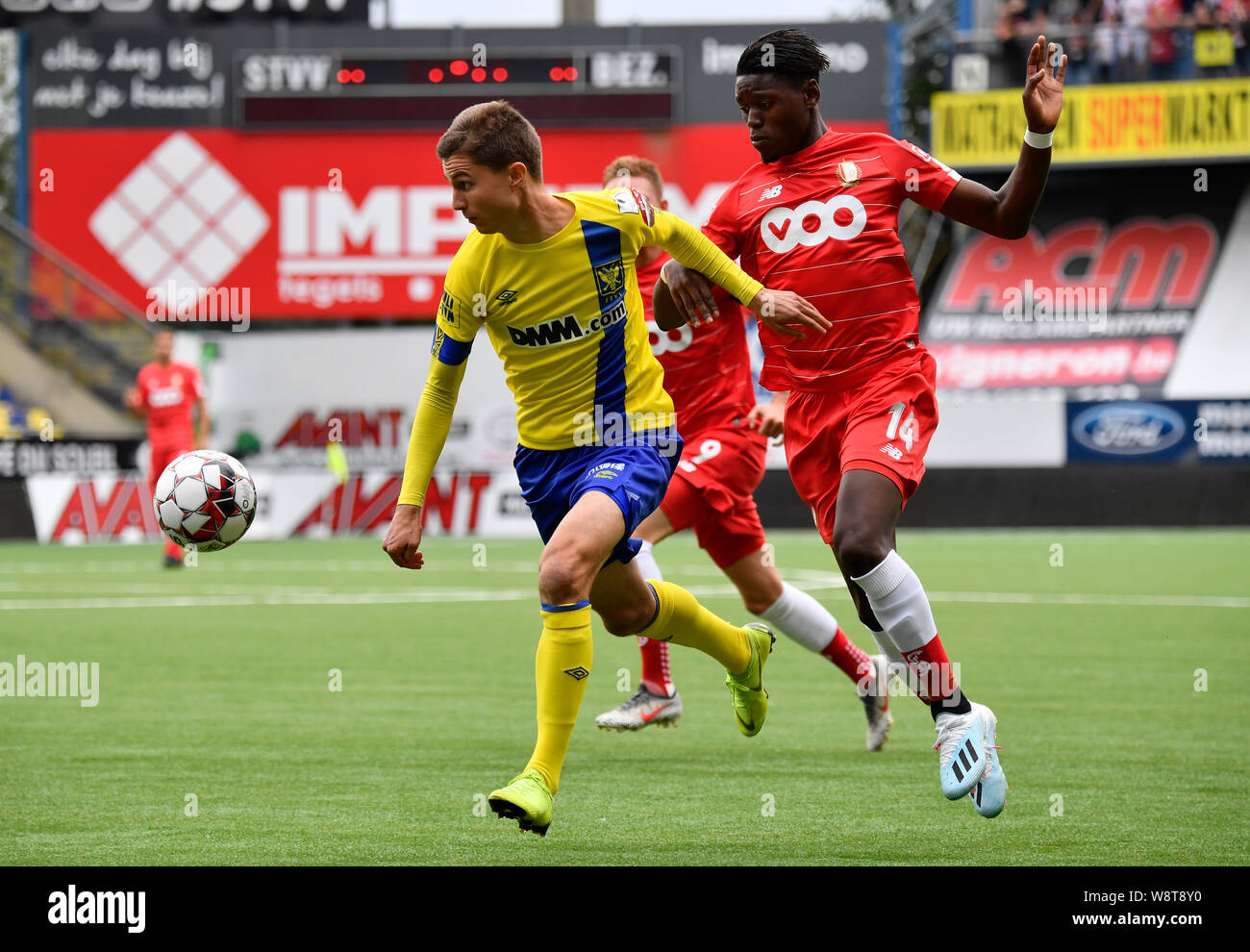 SINT-TRUIDEN, BELGIUM - AUGUST 11: Wolke Janssens of STVV fight for the ball with Anthony Limbombe of Standard during the Jupiler Pro League match day 3 between STVV and Standard de Liege on August 11, 2019 in Sint-Truiden, Belgium. (Photo by John Thys/Is Stock Photo