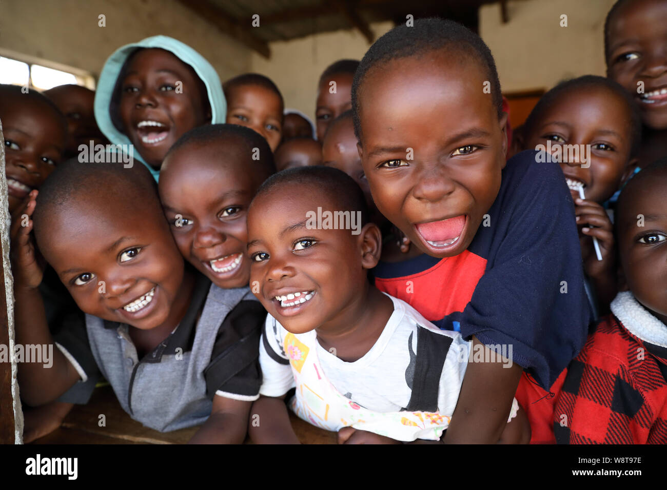 Students at the window of a primary school in Nkhotakota, Malawi. Malawi is one of the poorest countries in the world. Stock Photo