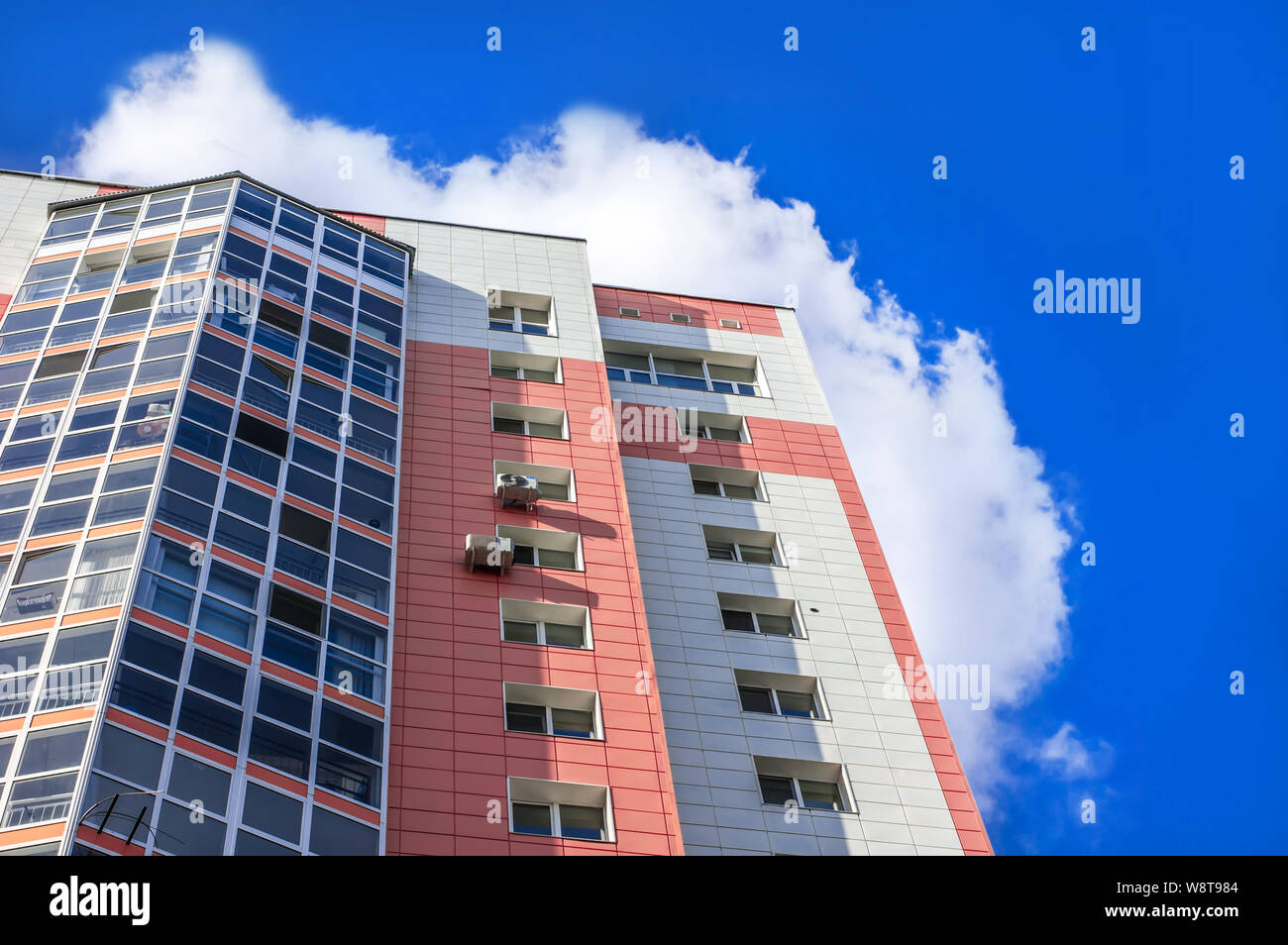 Multi-storey residential building on the blue sky and clouds Stock ...