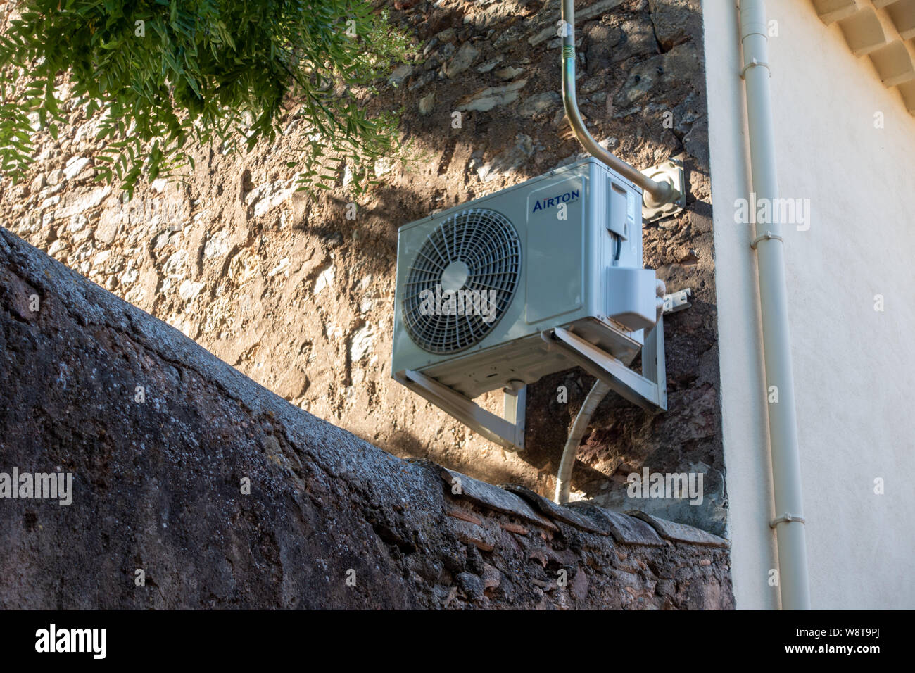 Air Conditioning Unit on the outside of house wall Stock Photo Alamy