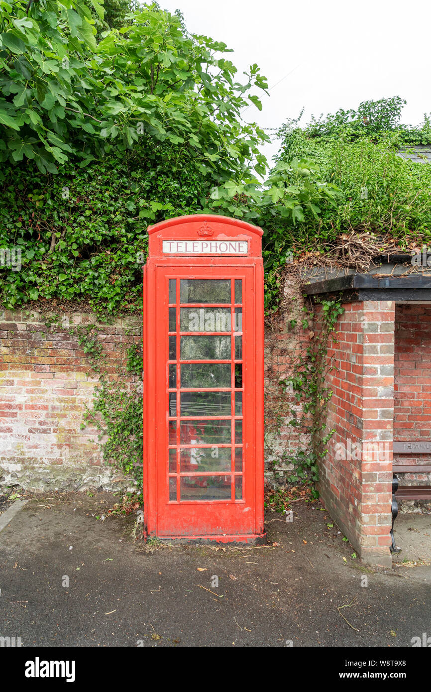 Disused K6 model red telephone kiosk Stock Photo
