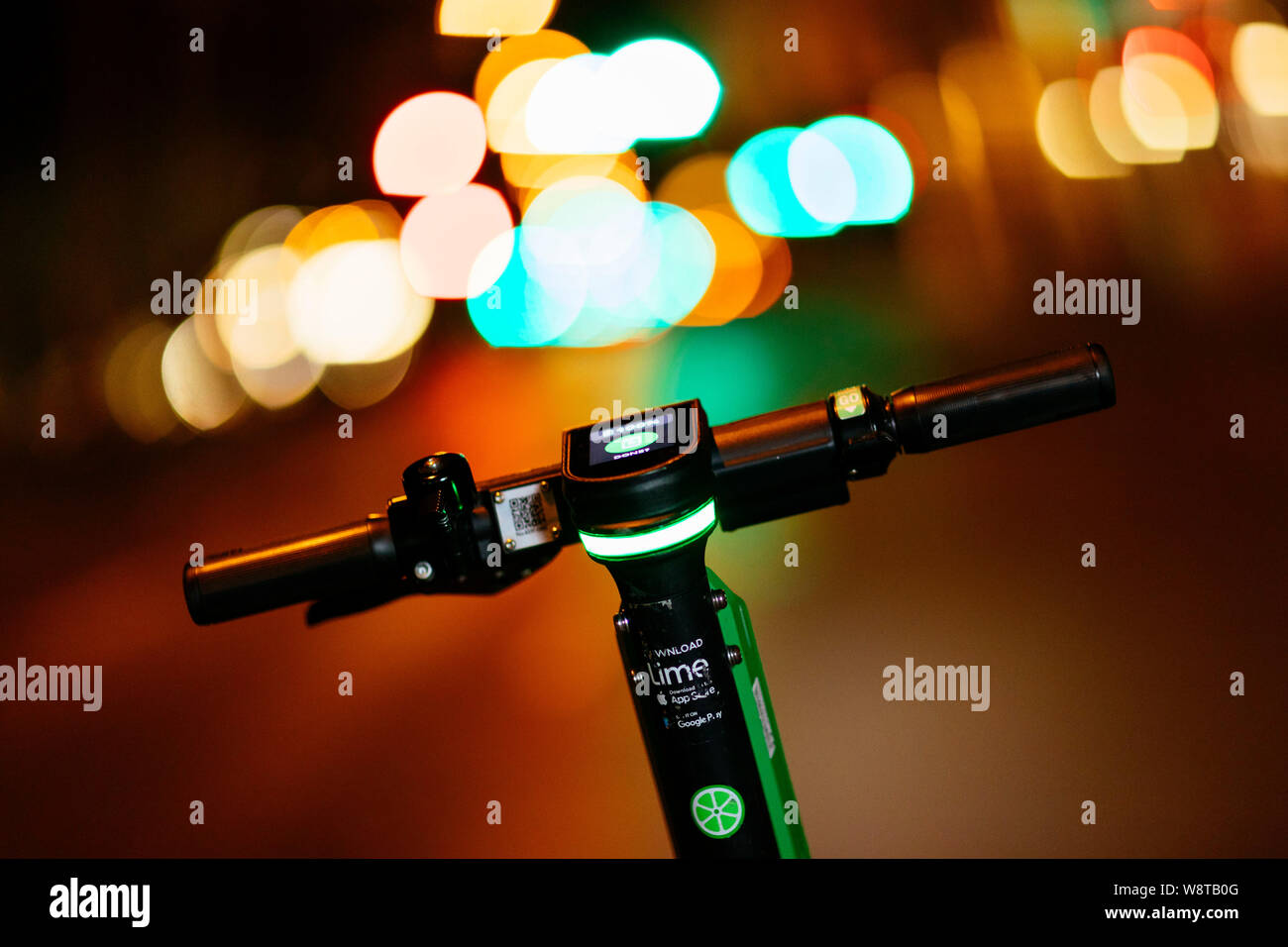 An escooter of the provider Lime stands on the Luxemburger Strasse