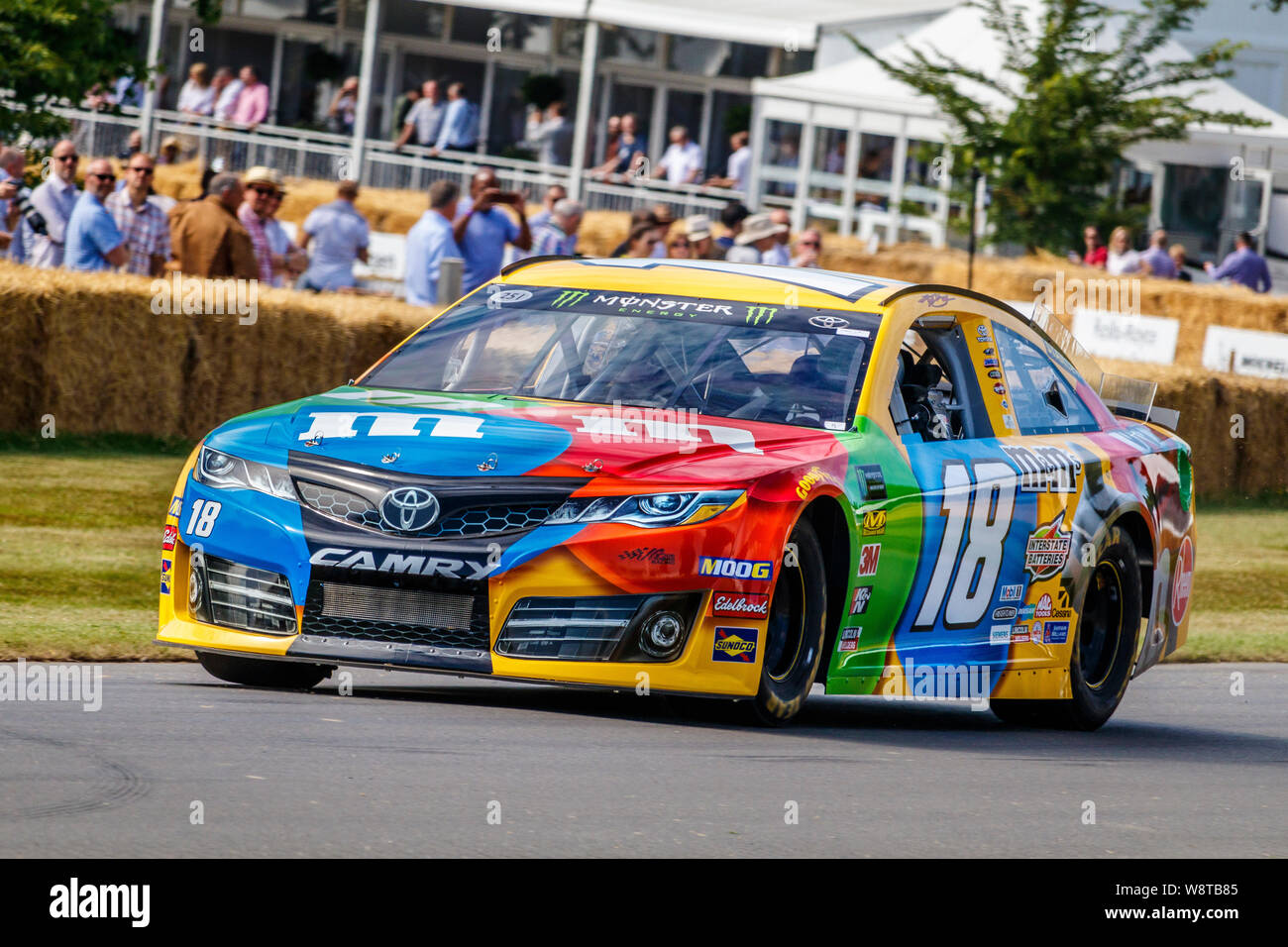 2014 Toyota Camry NASCAR with driver Anthony Reid in the M&M livery at the 2019 Goodwood Festival of Speed, Sussex, UK Stock Photo