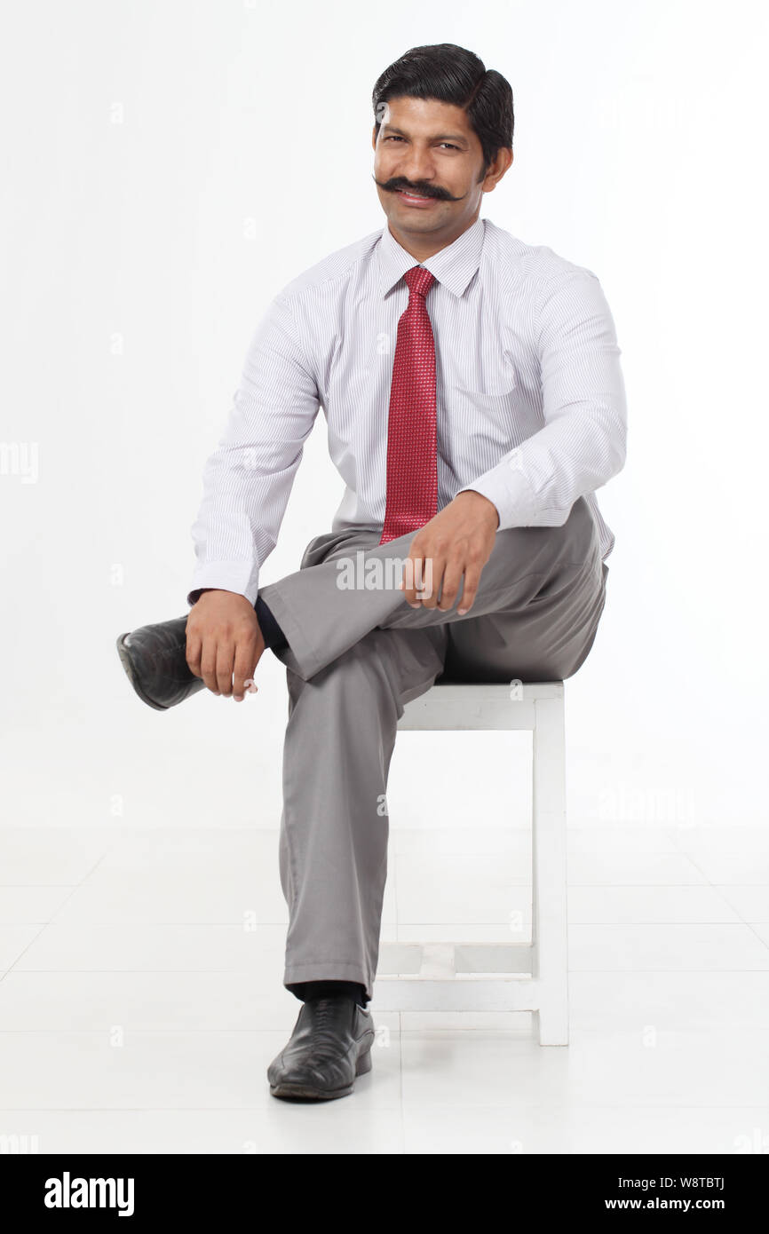 Employee sitting on stool hi-res stock photography and images - Alamy