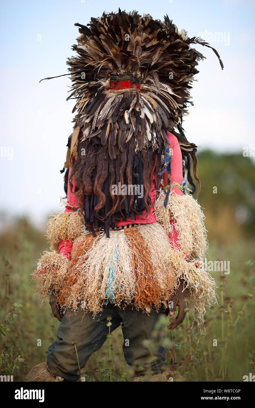 Traditional Nyau dancer with face mask at a Gule Wamkulu ceremony in remote village near Ntchisi. Malawi is one of the poorest countries in the world Stock Photo