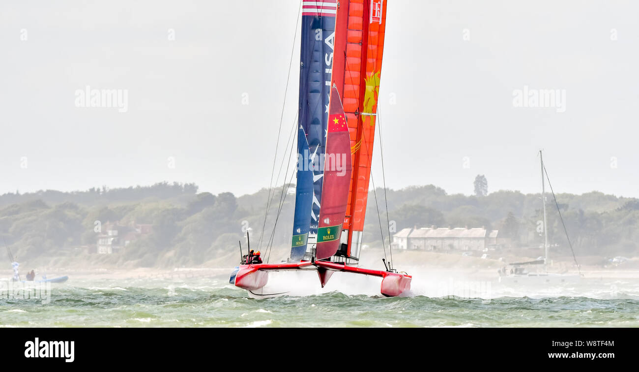 Cowes, Isle of Wight, UK. 11th August 2019. China SailGP Team helmed by Phil Robertson lead out Japan SailGP Team helmed by Nathan Outteridge during SailGP Cowes on 11 August 2019. Photo by Phil Hutchinson. Editorial use only, license required for commercial use. No use in betting, games or a single club/league/player publications. Credit: UK Sports Pics Ltd/Alamy Live News Stock Photo