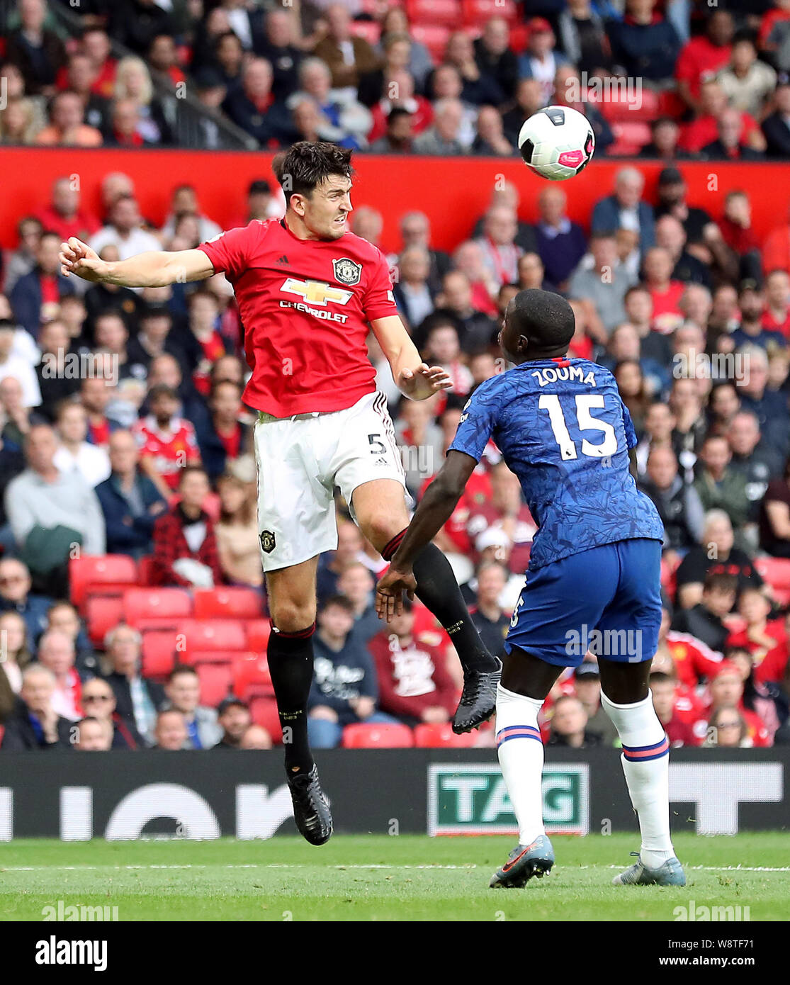 Manchester United S Harry Maguire Heads The Ball Watched By Chelsea S Kurt Zouma During The Premier League Match At Old Trafford Manchester Stock Photo Alamy