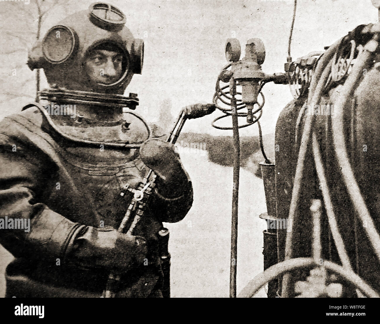 1940's Diver holding an autogene flame cutter for cutting by fire underwater Stock Photo