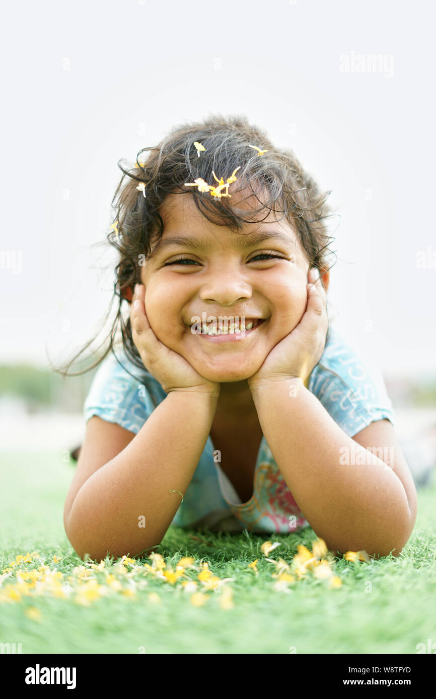Smiling happy Little Girl playing in the park Stock Photo - Alamy