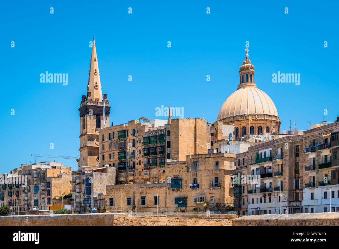 View of cathedral and belltower in old city centre of Valletta, Malta. Stock Photo