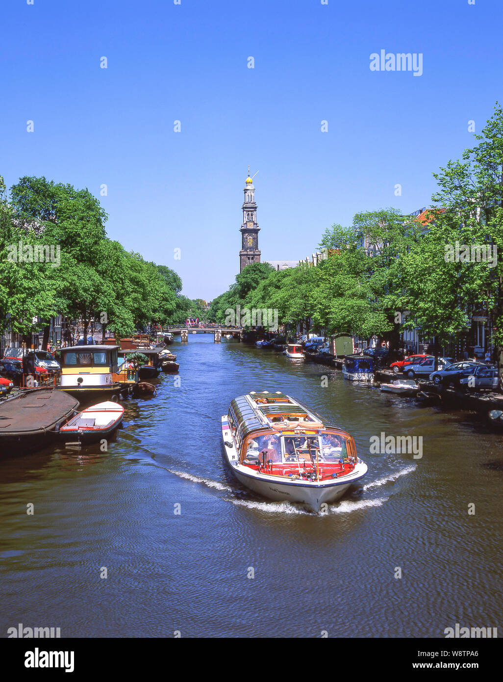 The Westertoren tower and excursion canal boat, Grachtengordel, Amsterdam, Noord-Holland, Kingdom of the Netherlands Stock Photo