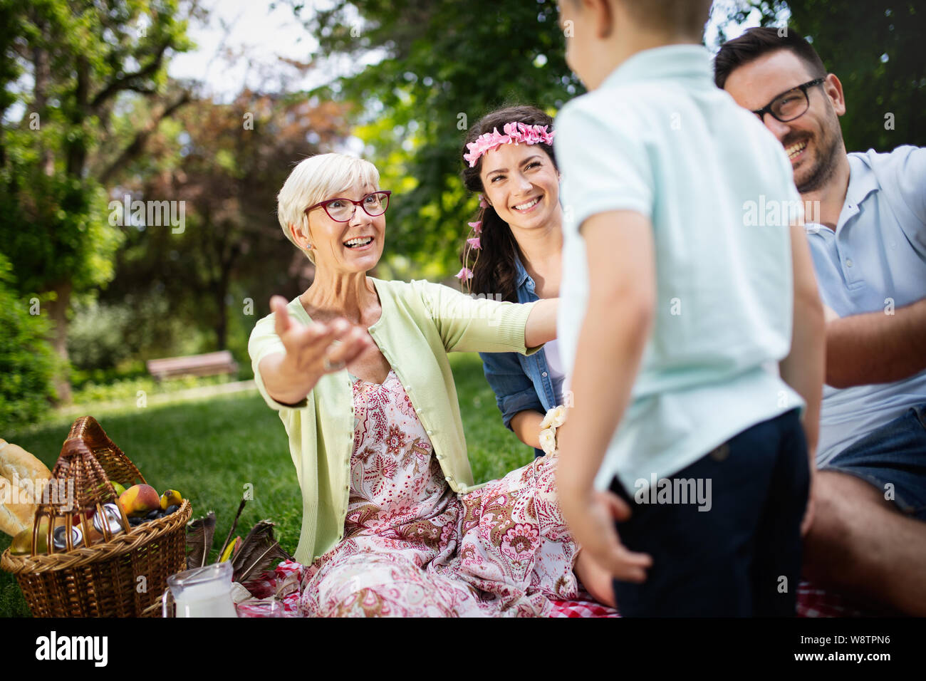 Family boy picnic basket eating hi-res stock photography and images - Alamy