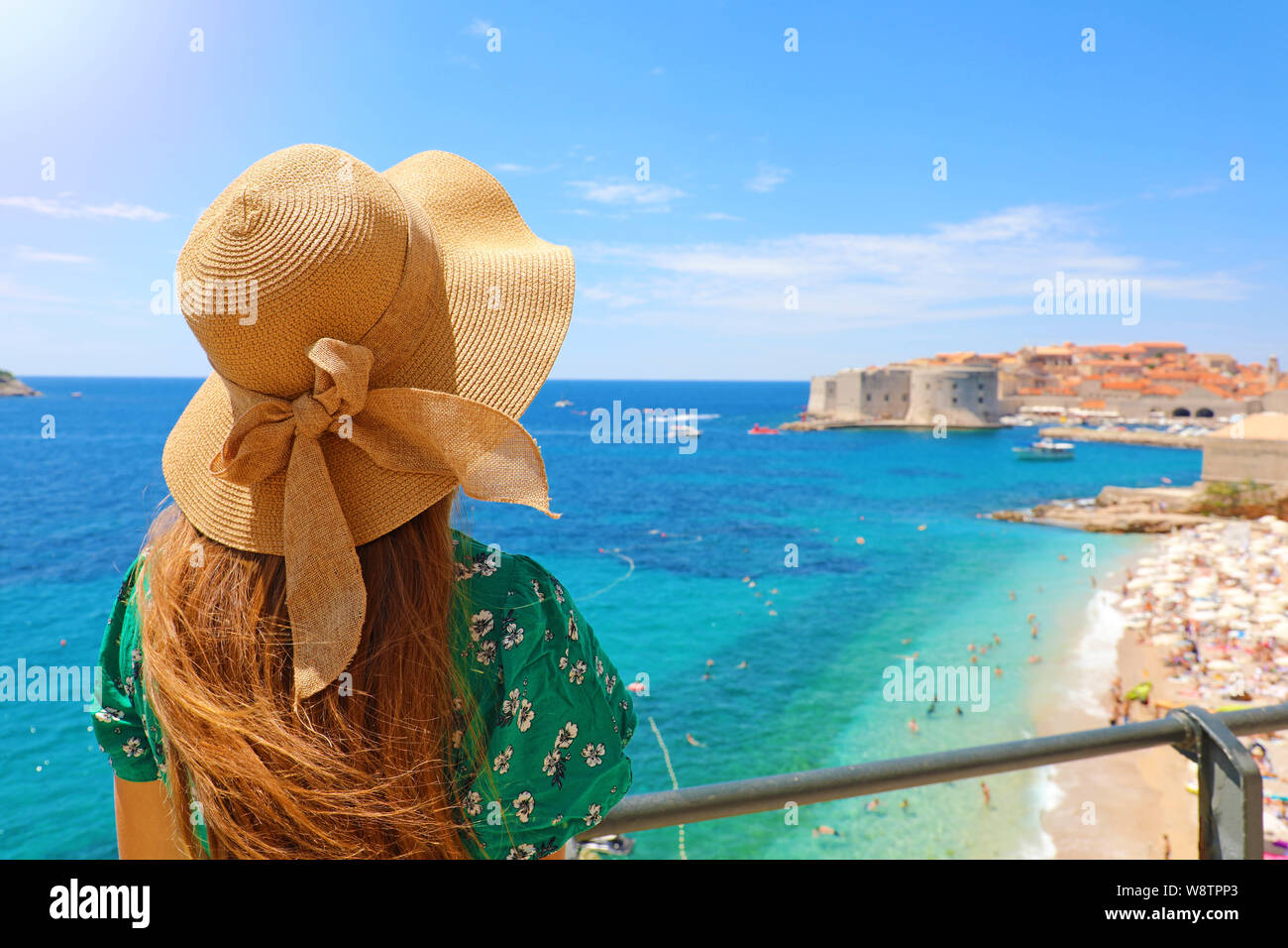 Summer Holiday In Croatia Back View Of Young Woman With Straw Hat And Green Dress With Dubrovnik Old Town On The Background Croatia Europe Stock Photo Alamy