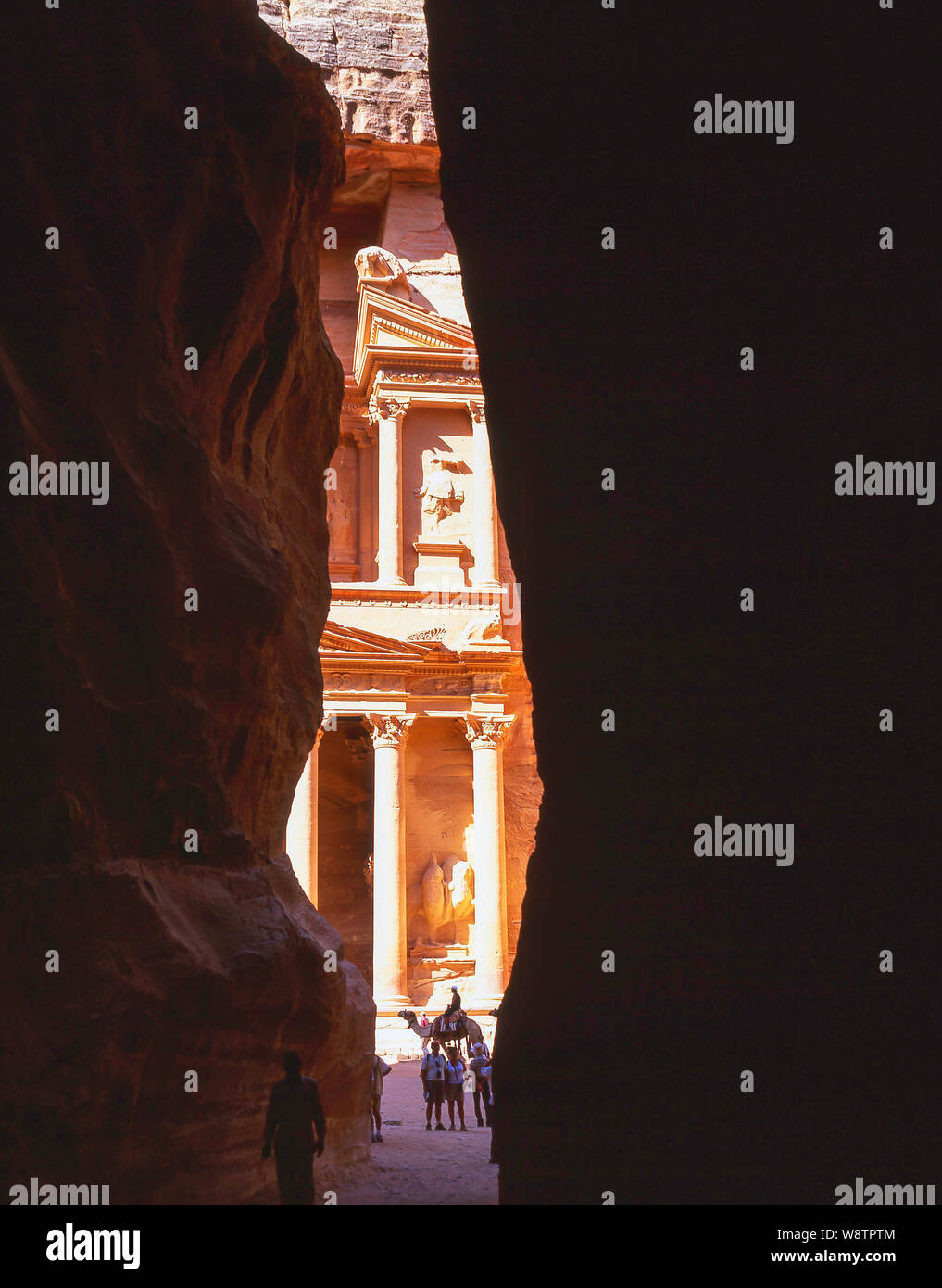 The Treasury (Al Khazneh) through cliff face entrance, Ancient City of Petra, Maan, Kingdom of Jordan Stock Photo