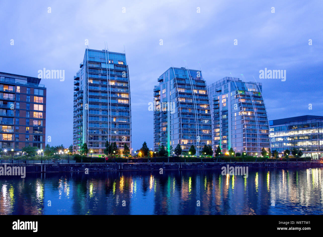 The NV high-rise apartment buildings at dusk, Salford Quays, Salford, Manchester, Greater Manchester, England, United Kingdom Stock Photo