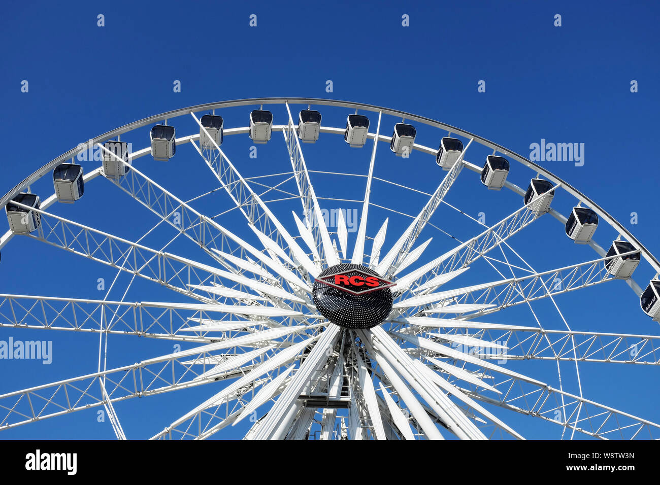 COSTA MESA, CALIFORNIA - AUG 8, 2019: Ferris Wheel closeup against a blue sky at the Orange County Fair. Stock Photo