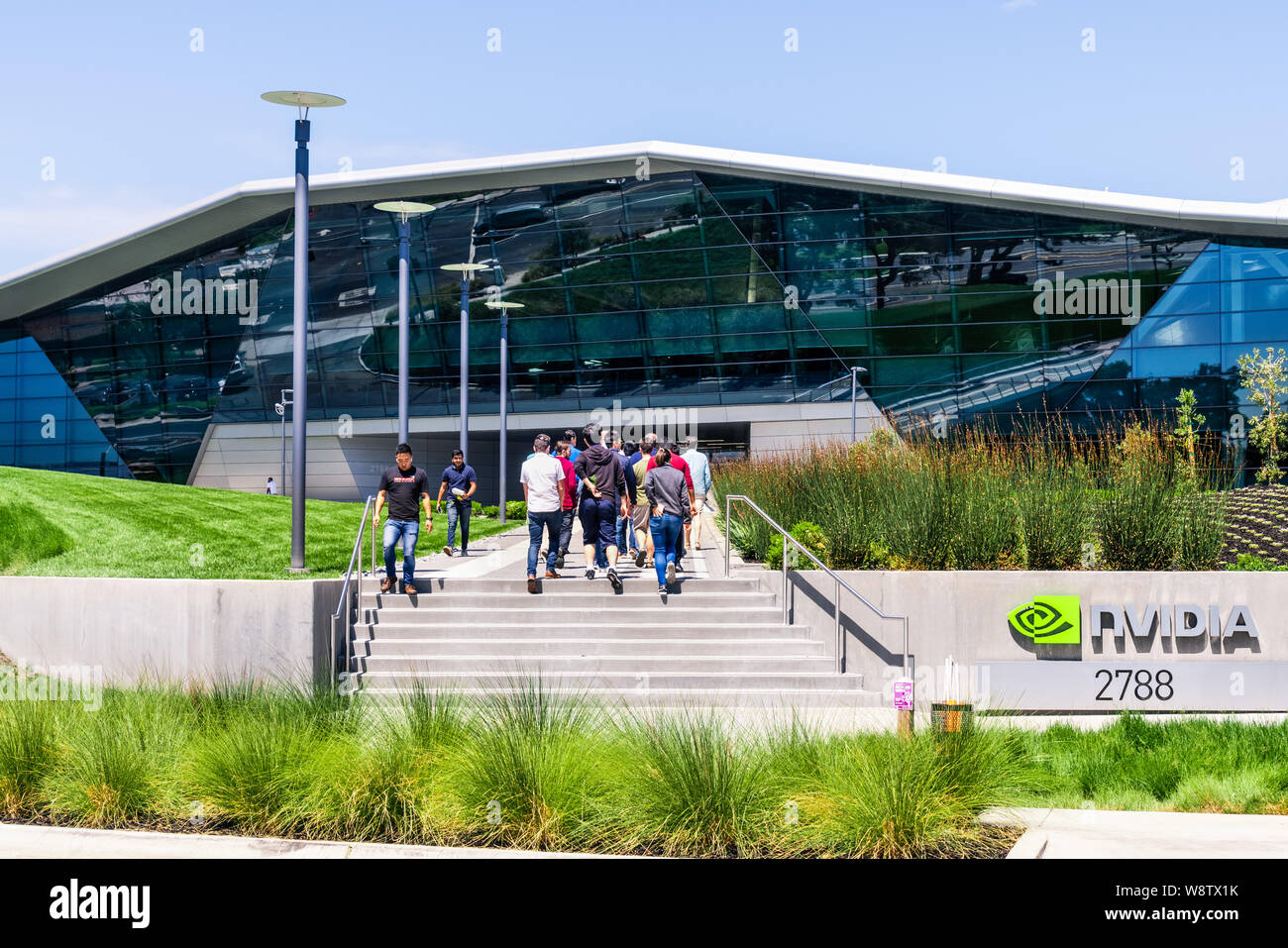 August 9, 2019 Santa Clara / CA / USA - People walking towards the entrance  to Nvidia Endeavor office building at the Company's corporate HQ in Silico  Stock Photo - Alamy
