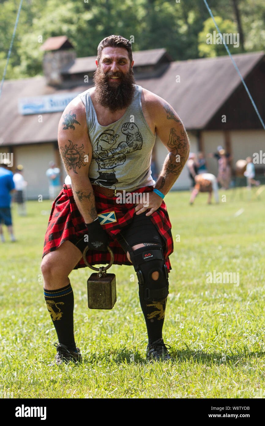 A man prepares to sling a 42 pound weight high over a bar in the weight over bar event, at the Blairsville Scottish Highland Games in Blairsville, GA. Stock Photo