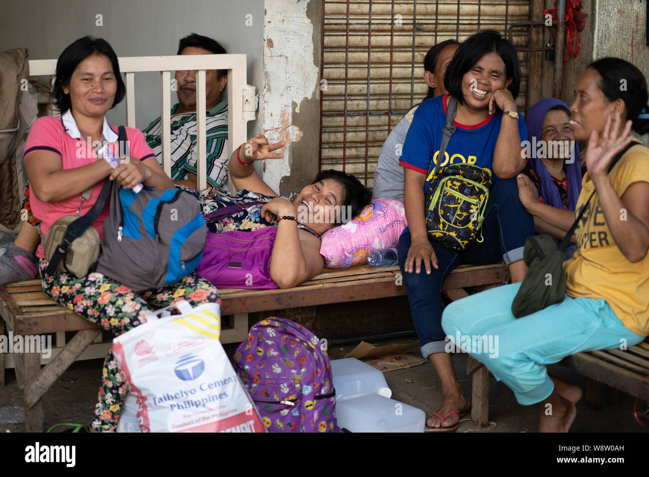 A group of Filipino women smiling towards the camera within a market area,Cebu City,Philippines, Stock Photo