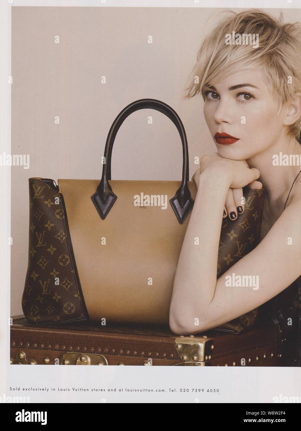 poster advertising Louis Vuitton handbag with Angelina Jolie actress in  paper magazine from 2012 year, advertisement, creative advert from 2010s  Stock Photo - Alamy