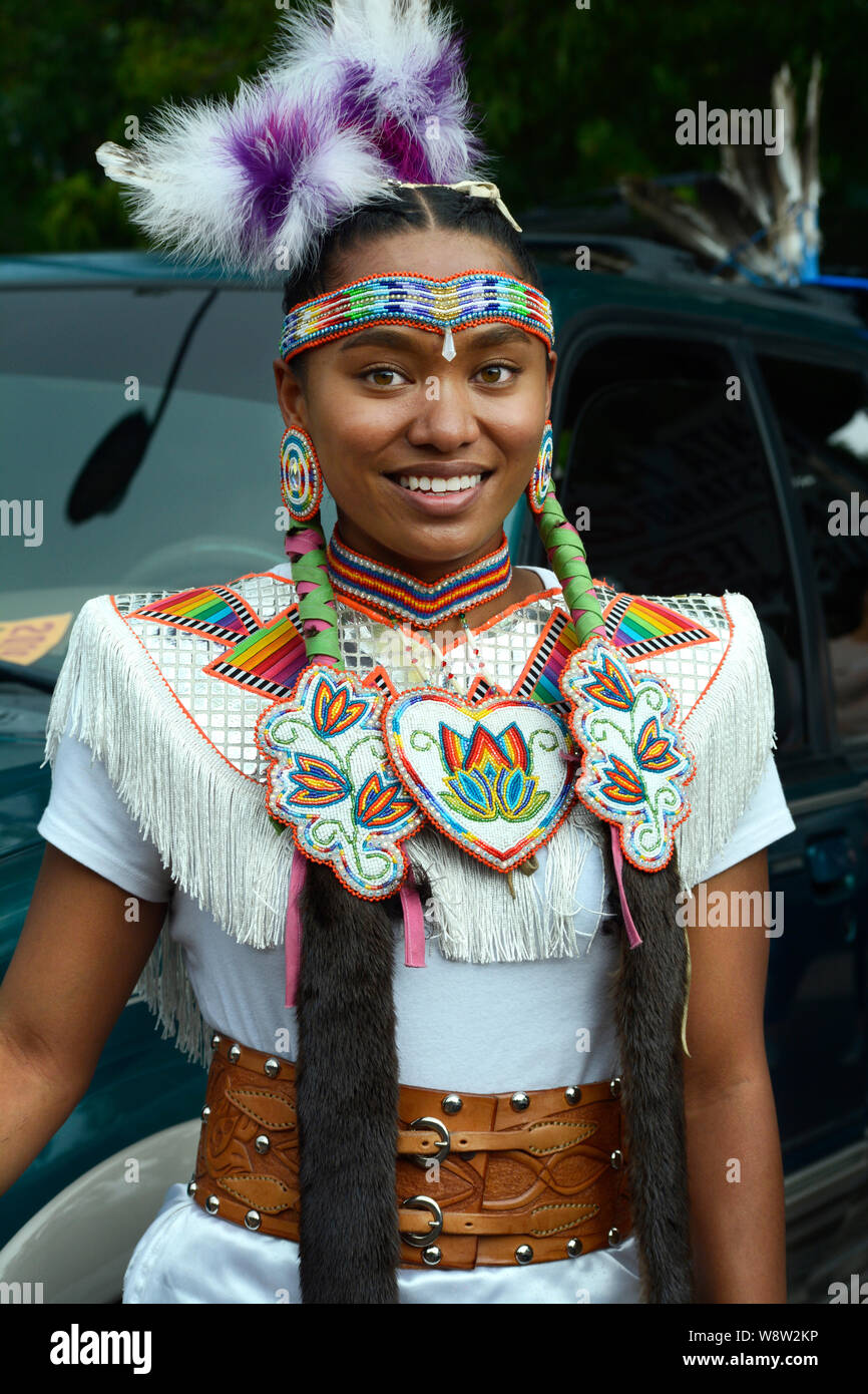 A young Native American woman from Taos Pueblo in New Mexico prepares