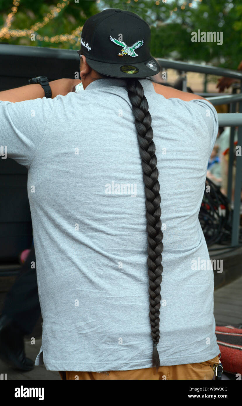 Young Native American man with long braided hairstyle Stock Photo