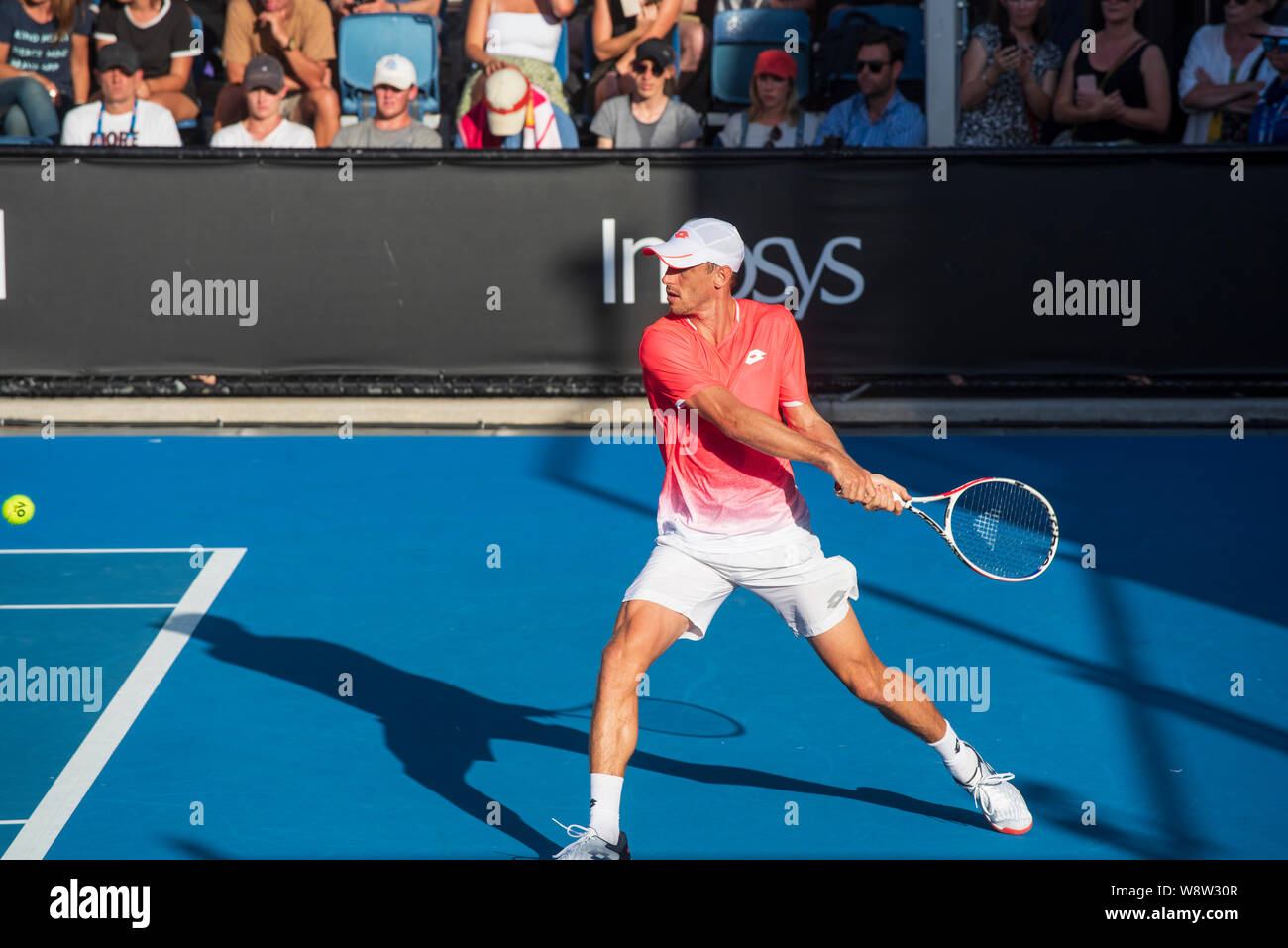 Australian tennis player John Millman playing a backhand shot in the Australian Open, Melbourne Stock Photo