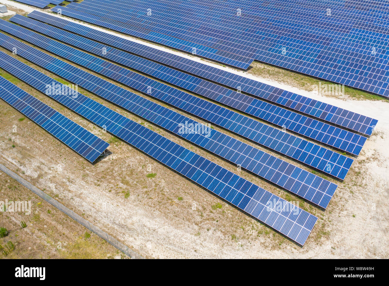 Aerial view of large solar panel farm in Northern Florida providing
