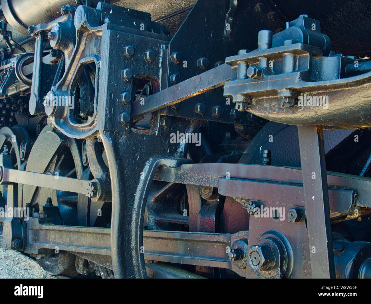 Drive wheel and piston rods of a rail road steam engine Stock Photo