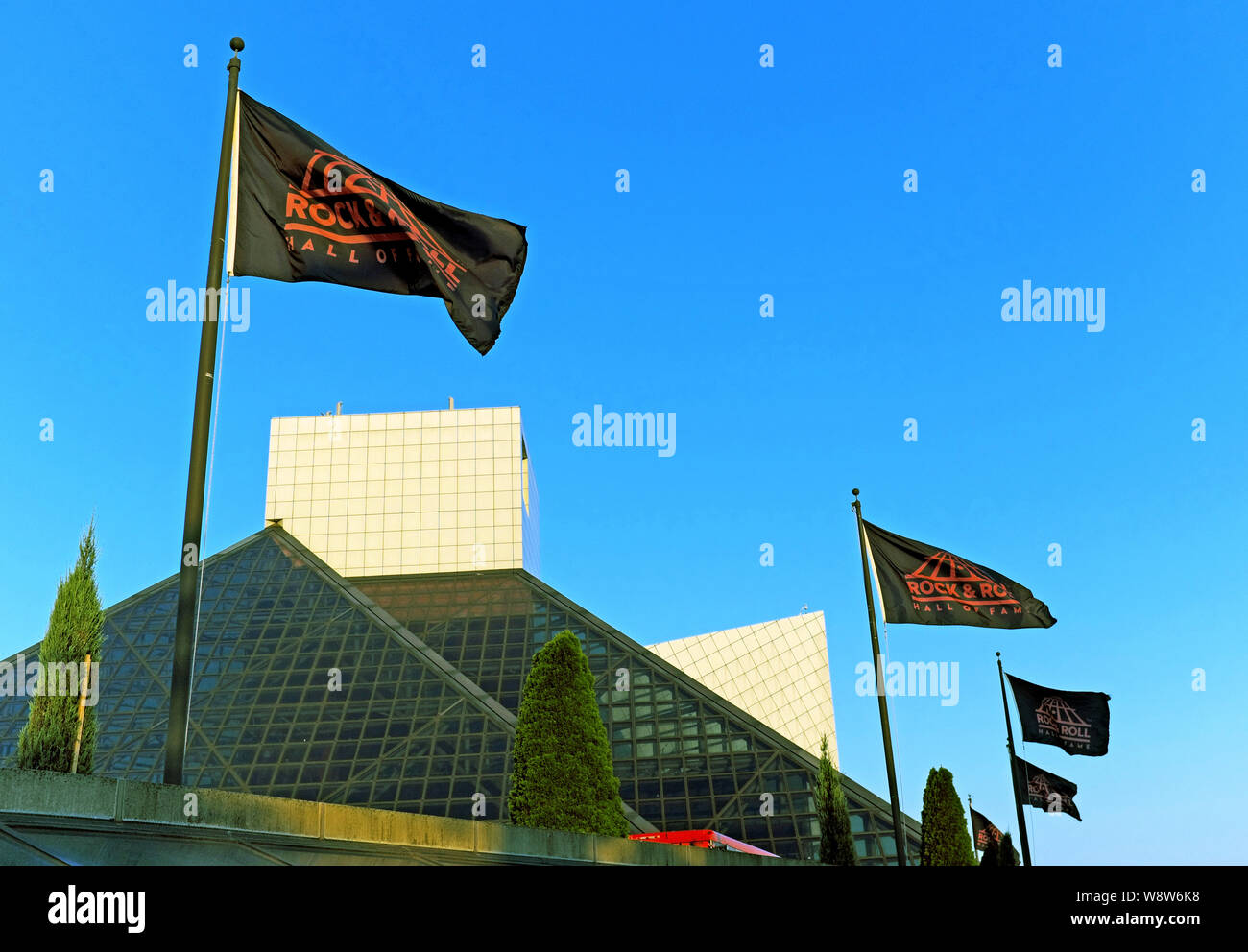 Flags fly outside the Rock and Roll Hall of Fame and Museum in Cleveland, Ohio, USA. Stock Photo