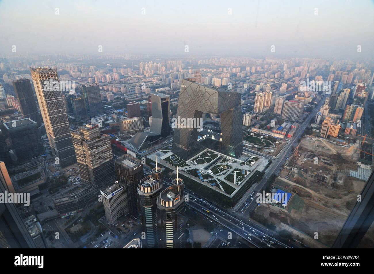 --FILE--View of the CCTV Tower, center, the headquarters of China Central Television, and other high-rise buildings in CBD (Central Business District) Stock Photo