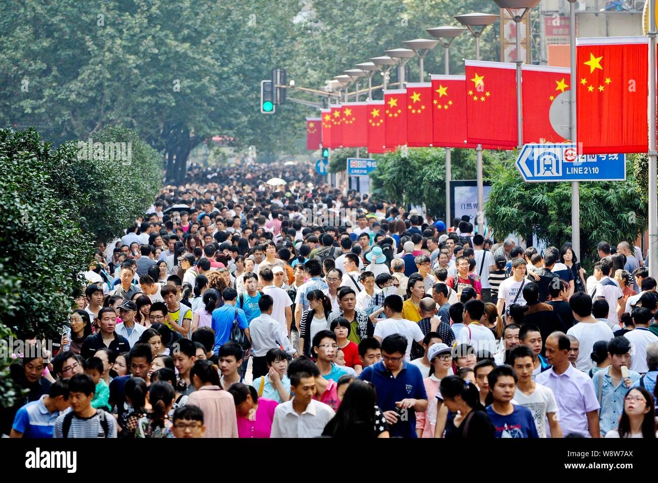 Tourists Crowd The Nanjing Road Pedestrian Shopping Street During The 